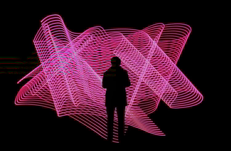 Systems thinking. Pink neon lights in wave shape