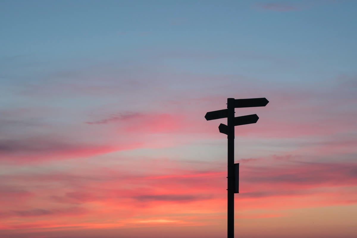 javier-allegue-barros-C7B-ExXpOIE-unsplash_signpost_dawn_sunset_directions